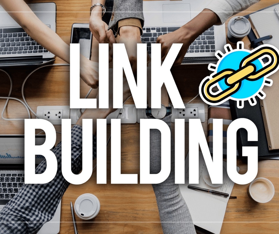 People join hands at a business meeting and the words “link building” are written on top